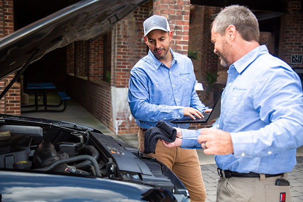 Service Technicians Working on a Car